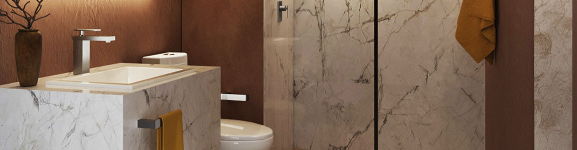 Grifería Limited en acabado titanio en un baño lujoso con elementos naturales